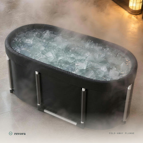 Revora Fold-Away Plunge Tub filled with ice water, in soft steam