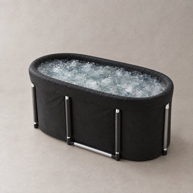 Revora Fold-Away Plunge Tub, a black fabric tub with aluminium poles, filled with ice water
