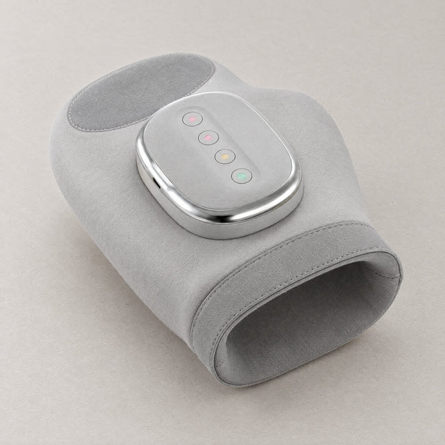Revora Hand Massager, a soft grey air-pressure massager for the hand and wrist