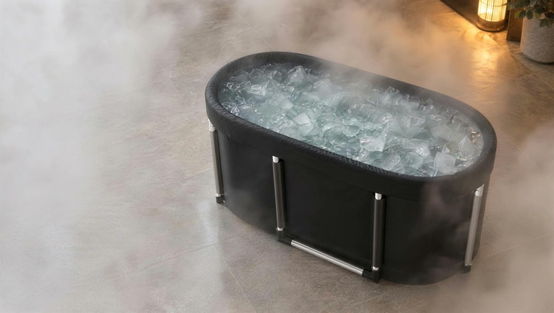 The Fold-Away Plunge filled with ice water, seen from above through soft steam