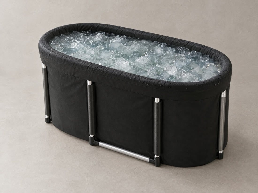 The Fold-Away Plunge, a black oval tub filled with ice water, in soft steam